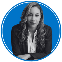 The image shows a woman with long, curly hair wearing a black blazer and a white blouse, set against a bright blue background.